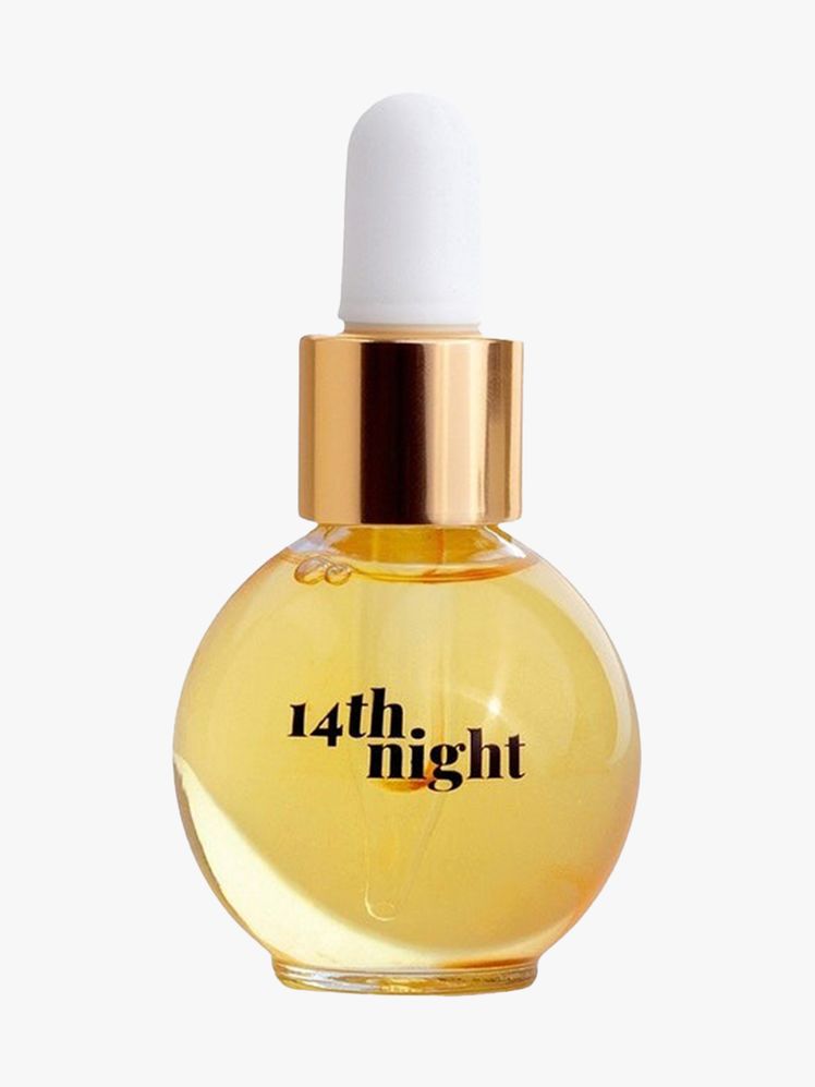 14th Night The Hair Elixir round serum dropper bottle of hair oil on light gray background