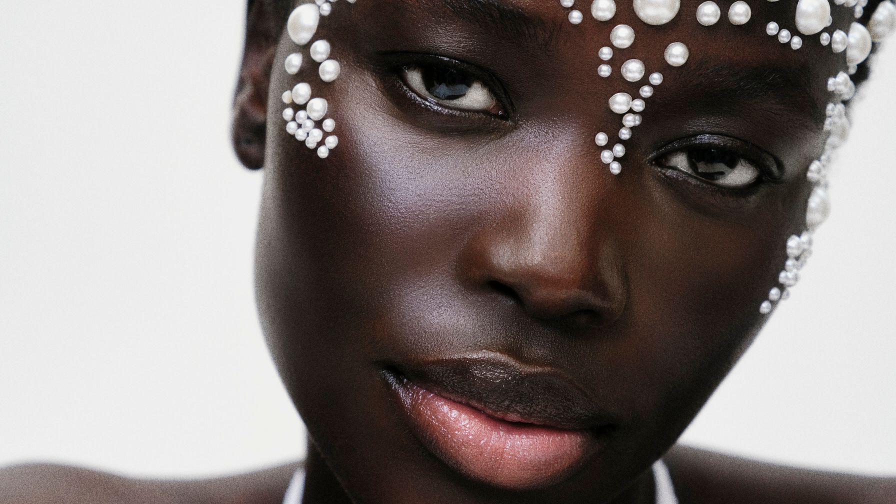 Woman with pearls on forehead