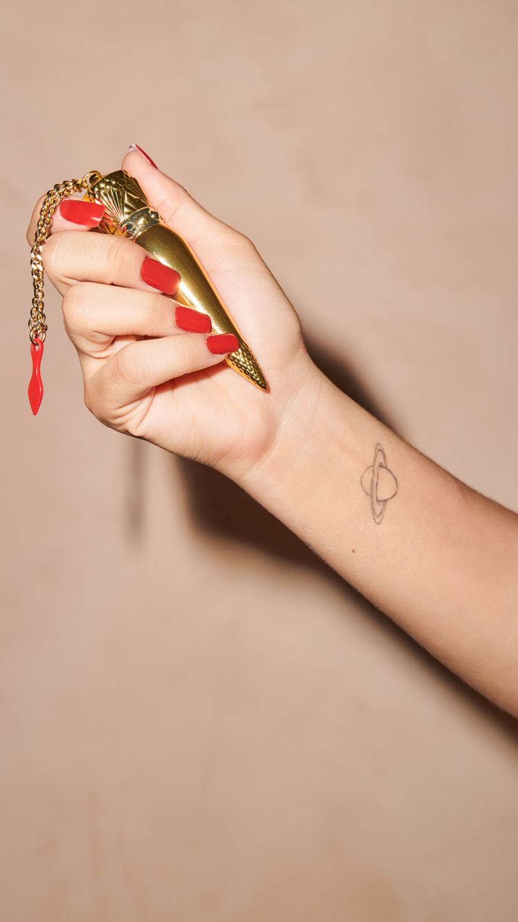 Image may contain Body Part Finger Hand Person Bottle Cosmetics Perfume Wrist Skin and Tattoo