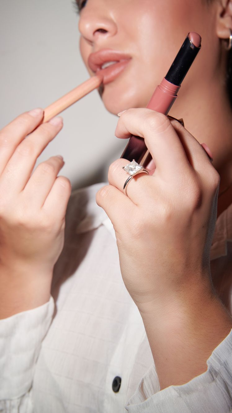 angela trakoshis applying lip products