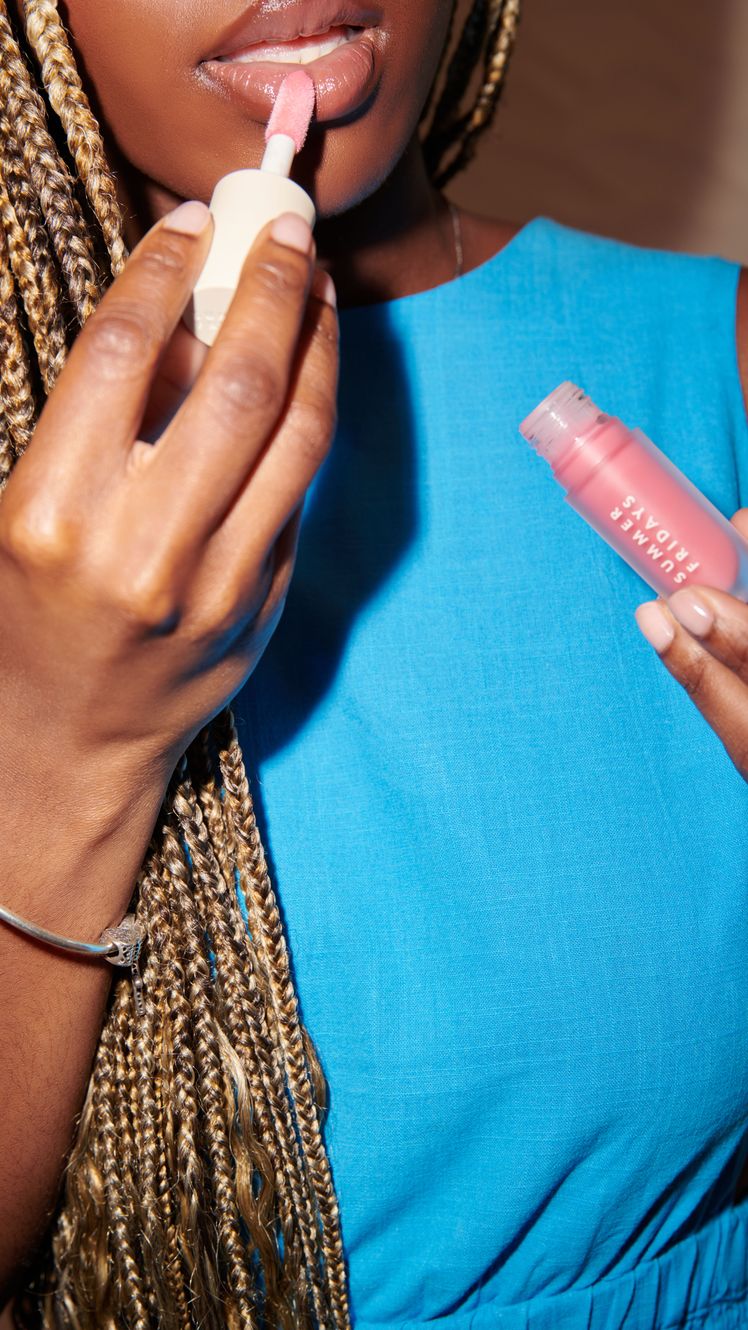 Image may contain Cosmetics Lipstick Adult Person Body Part Finger and Hand