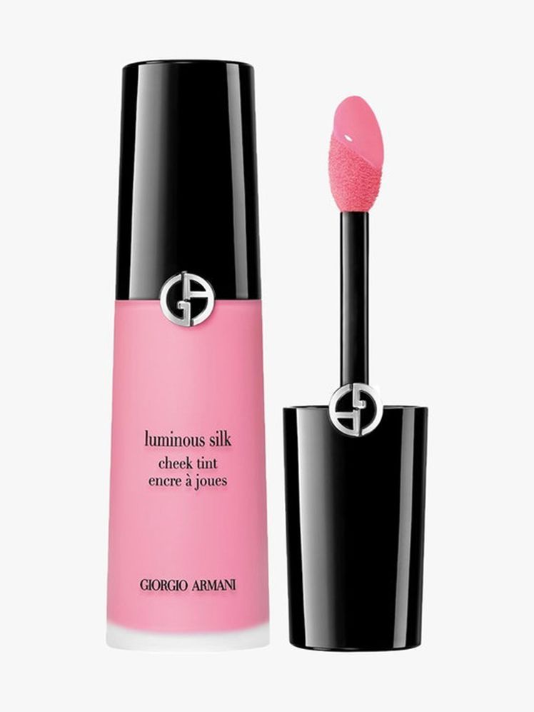 Armani Beauty Luminous Silk Cheek Tint vial of pink liquid blush with black cap and wand to the side on light gray...