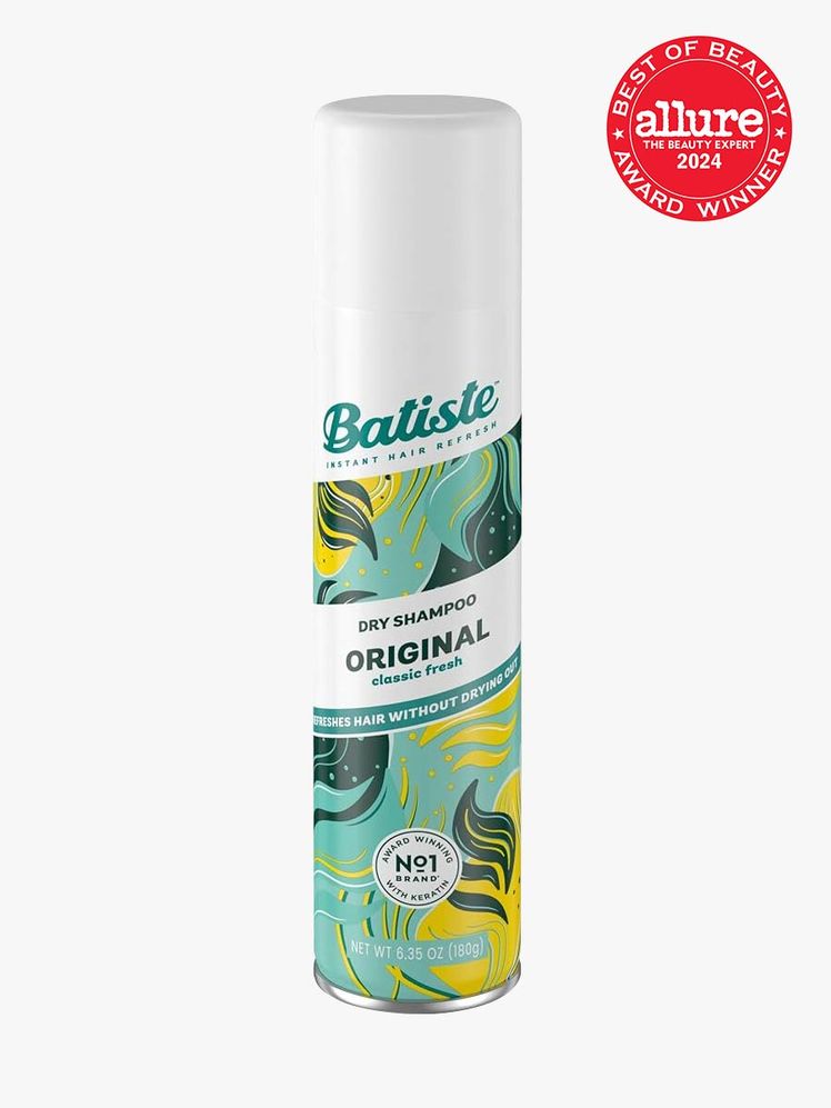 dry shampoo in branded yellow and green patterned bottle with white cap on light gray background with red and white 2024...