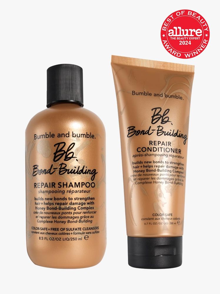 shampoo and conditioner duo in branded copper components with black caps on light gray background with red and white...