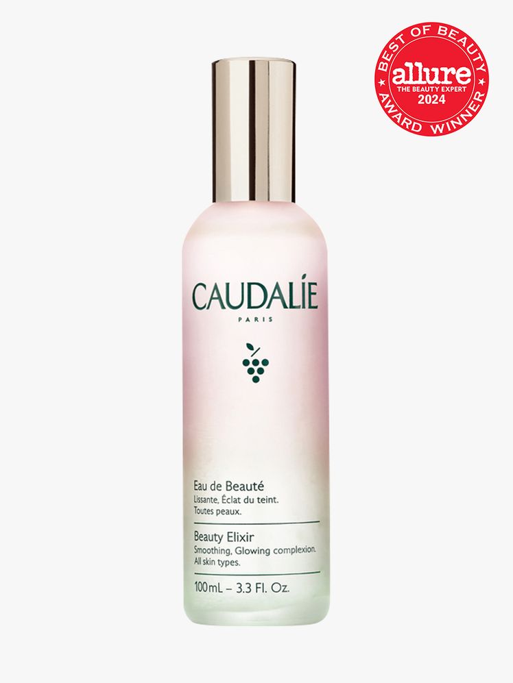 facial mist in branded gradient bottle with soft gold cap on light gray background with red and white 2024 allure best...