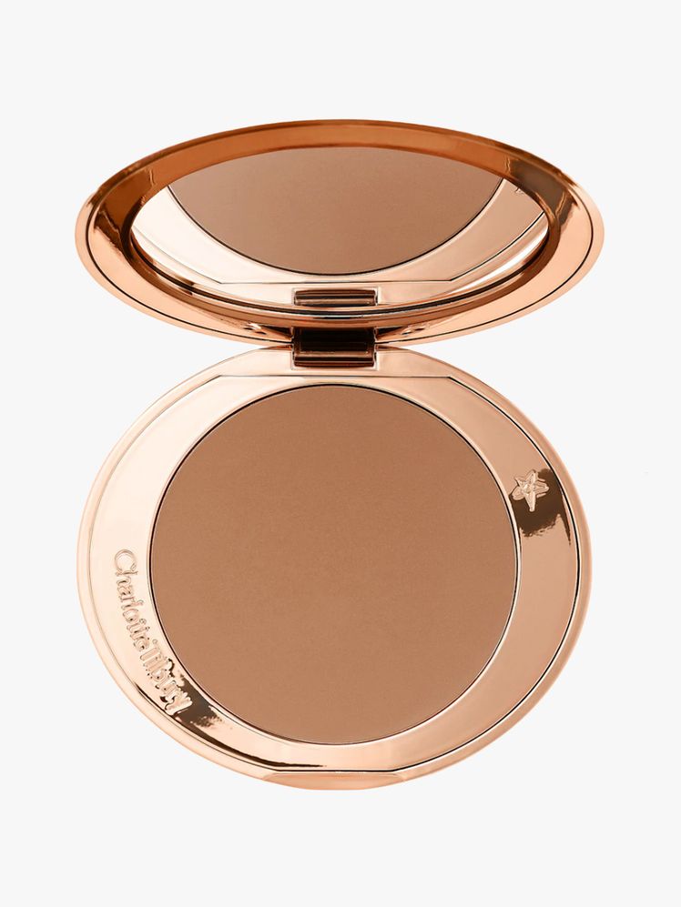 Charlotte Tilbury Airbrush Bronzer round gold compact of bronzer on light gray background