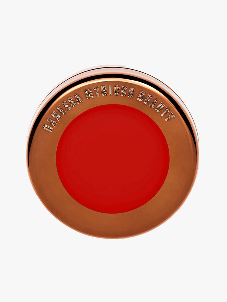Danessa Myricks Beauty Yummy Skin Blurring Balm Powder Flushed in Red Velvet round bronze compact of warm red blush balm...