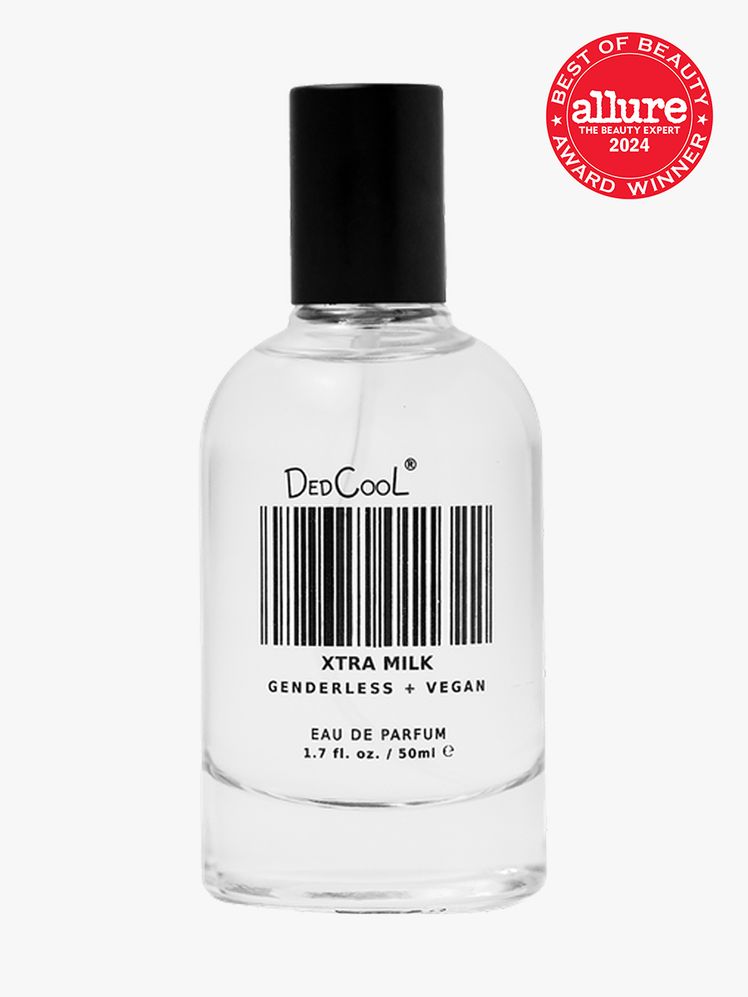 Dedcool Xtra Milk Fragrance branded bottle component with a black cap and black accents on a light gray background with...