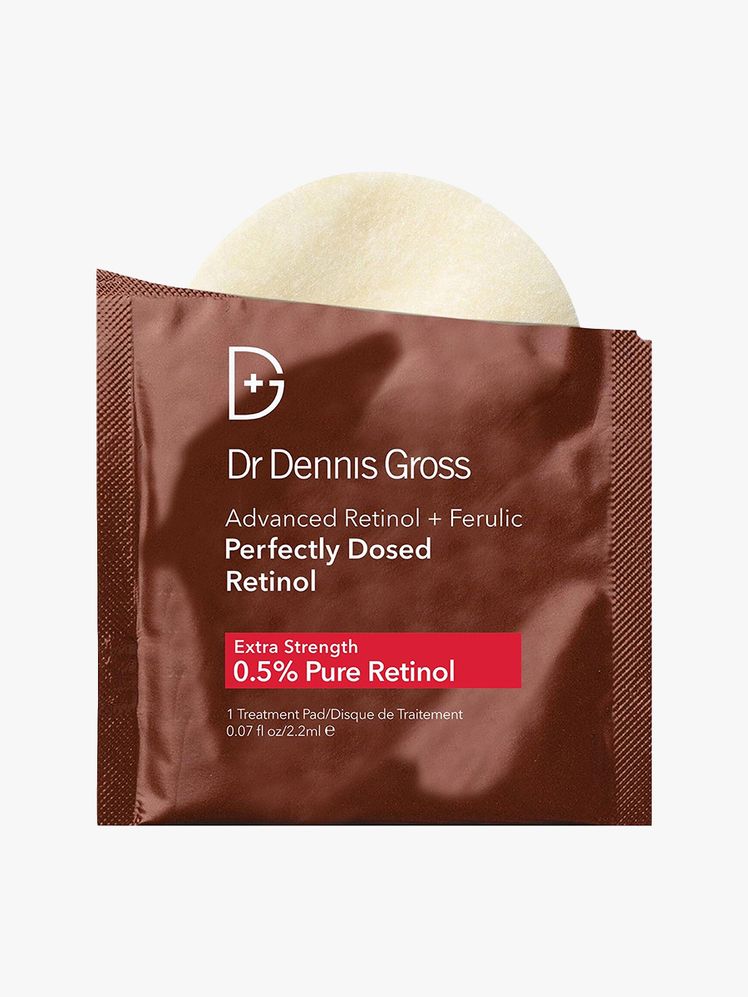 Dr. Dennis Gross Advanced Retinol  Ferulic Perfectly Dosed Retinol brown packet of creamy serum on light gray background