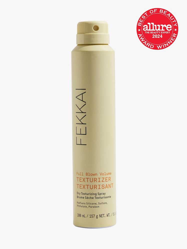 spray in branded yellow aerosol bottle with spray nozzle on light gray background with red and white 2024 allure best of...