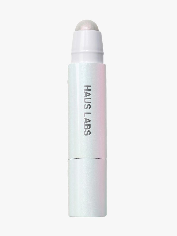 Haus Labs Bio-Radiant Glassy Highlighter Balm white twist up highlighter balm stick on light gray background