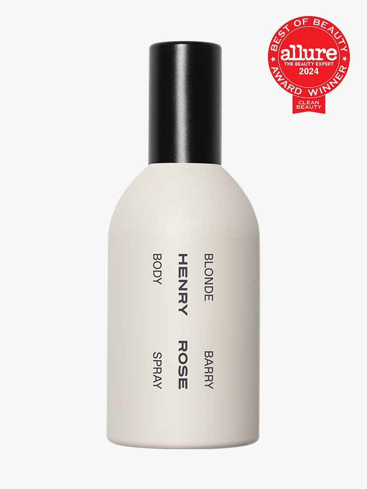 body spray in branded beige bottle with black cap on light gray background with red and white 2024 allure best of beauty...