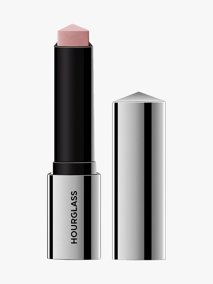 Hourglass Vanish Flash Highlighting Stick black and silver twist up triangle pink highlighter stick with cap to the side on light gray background