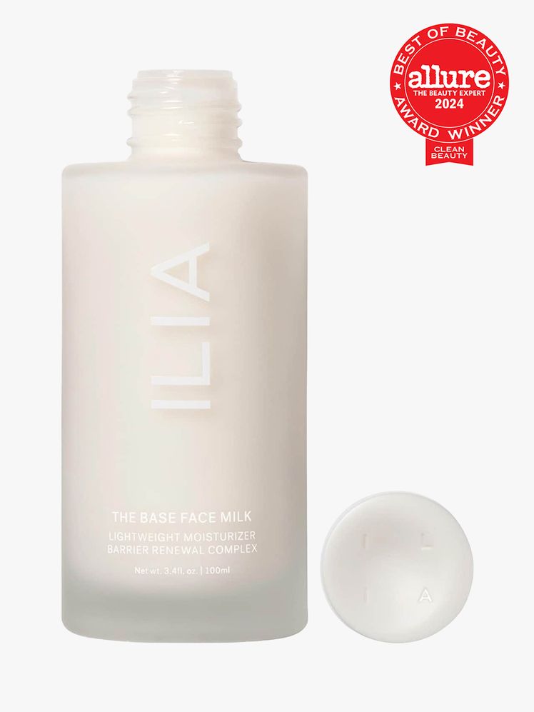 ILIA The Base Face Milk white bottle with cap to the side on light gray background with red Allure Clean Best of Beauty...