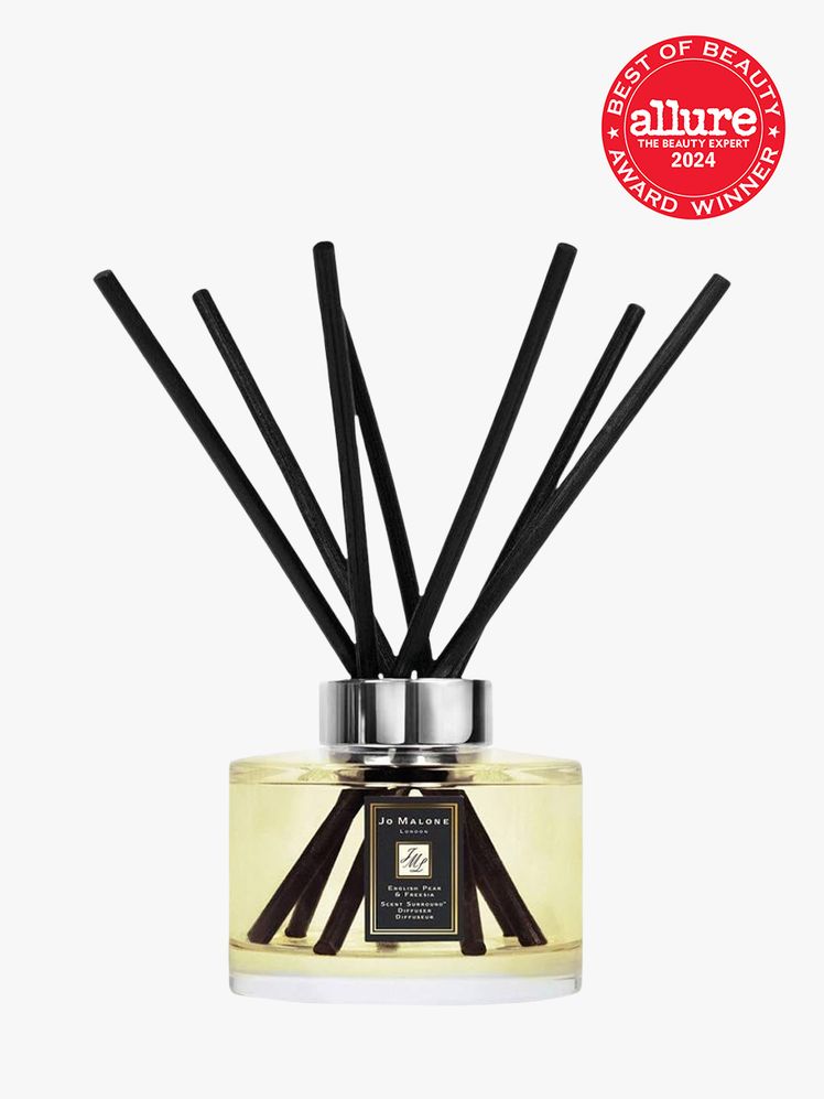 Jo Malone London English Pear  Freesia Diffuser clear branded component with silver accents on a light gray background...
