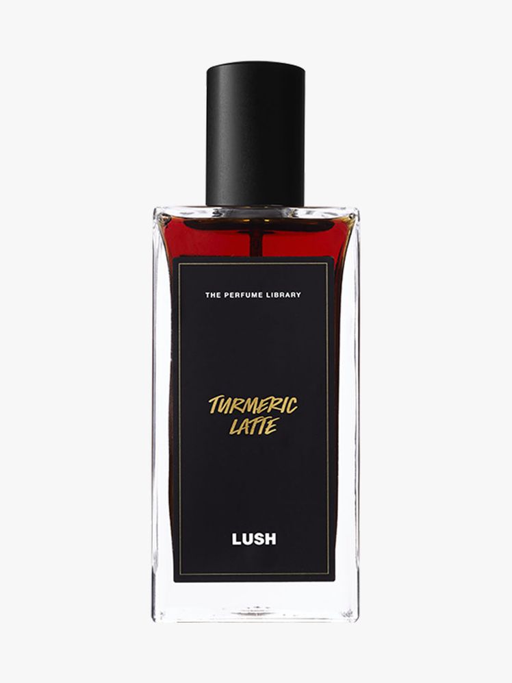 Lush Turmeric Latte Perfume rectangle bottle of red perfume with black label on light gray background