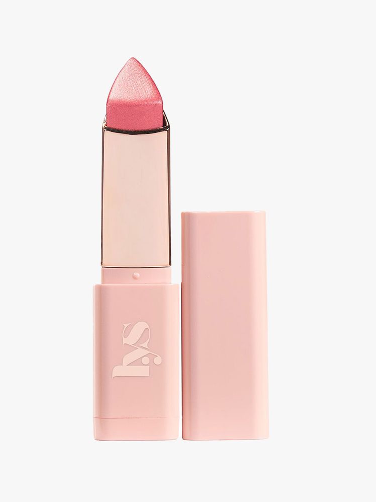 An open tube of metallic rose gold Higher Standards Glow Blush Stick 