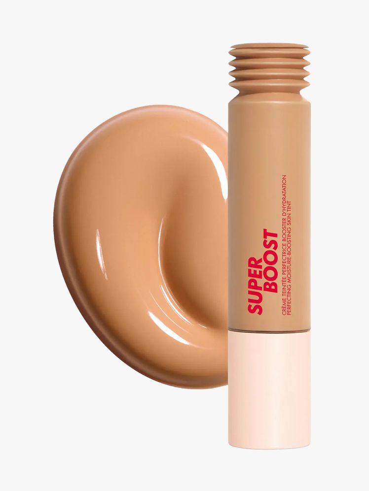 Make Up For Ever Super Boost Skin Tint tube of skin tint and round swatch on light gray background