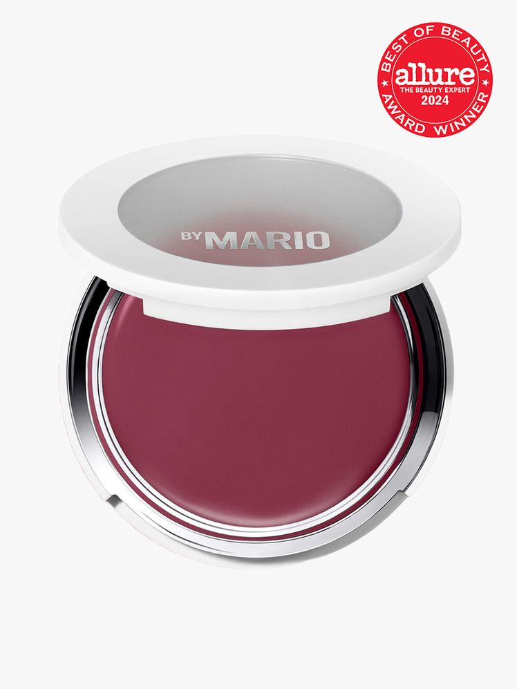 Makeup by Mario Soft Pop Plumping Blush Veil compact of berry cream blush on a light gray background with red Allure...