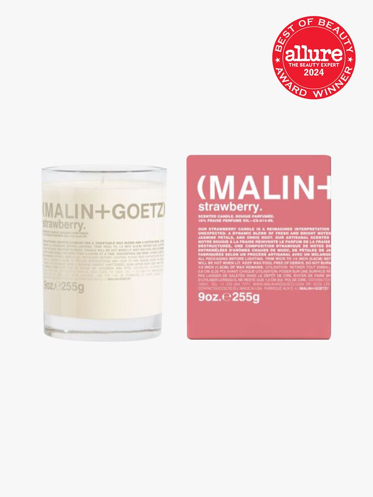 MalinGoetz Strawberry Candle branded component in strawberry on a light gray background with red Allure Best of Beauty...