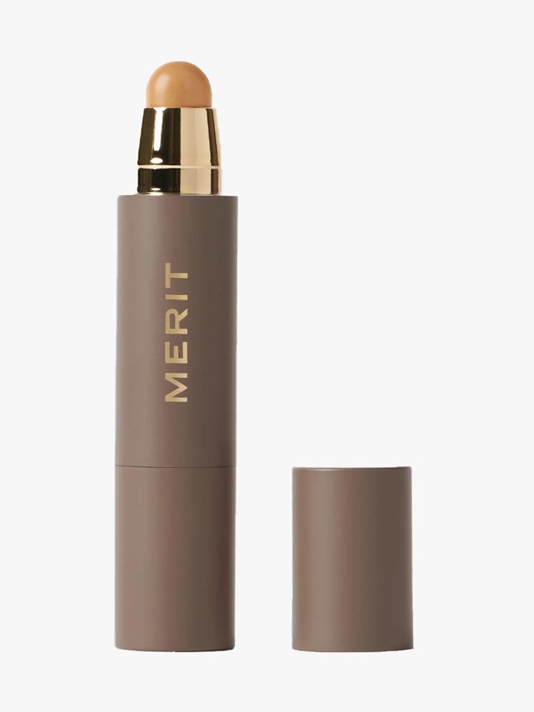 Merit The Minimalist gray twist up foundation stick on light gray background