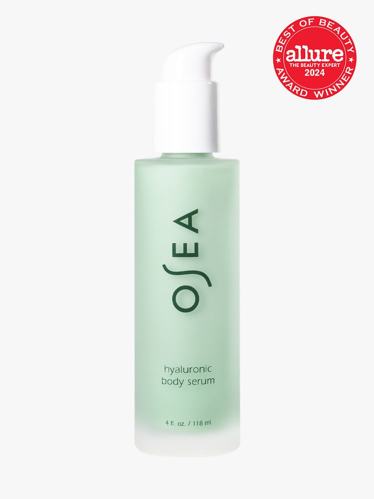 body serum in branded clear bottle with white pump on light gray background with red and white 2024 allure best of...
