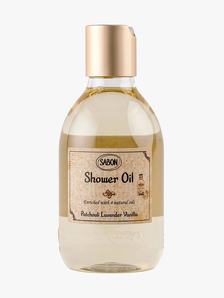 Sabon Patchouli Lavender Vanilla Shower Oil bottle of beige shower oil with light brown label and cap on light gray...