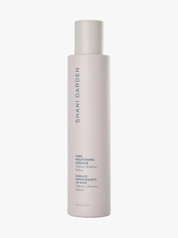 Shani Darden Sake Nourishing Essence gray bottle on light gray background