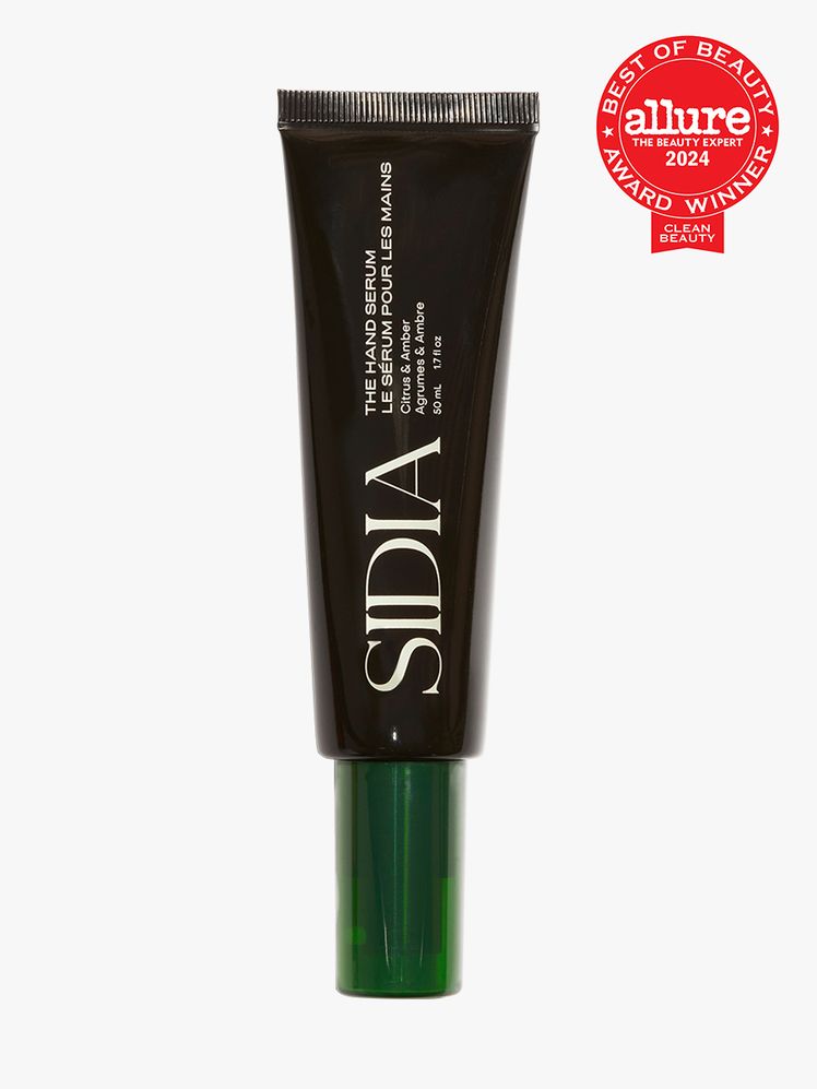 hand serum in branded black tube with dark green cap on light gray background with red and white 2024 allure best of...