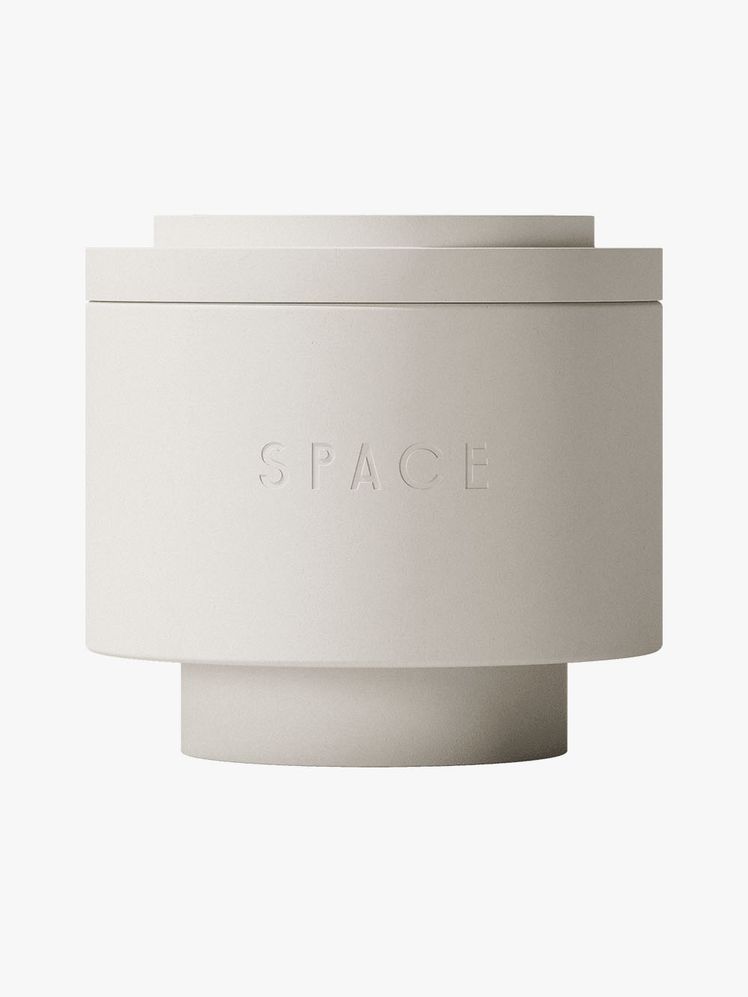 Space Saint Candle beige tiered candle vessel on light gray background