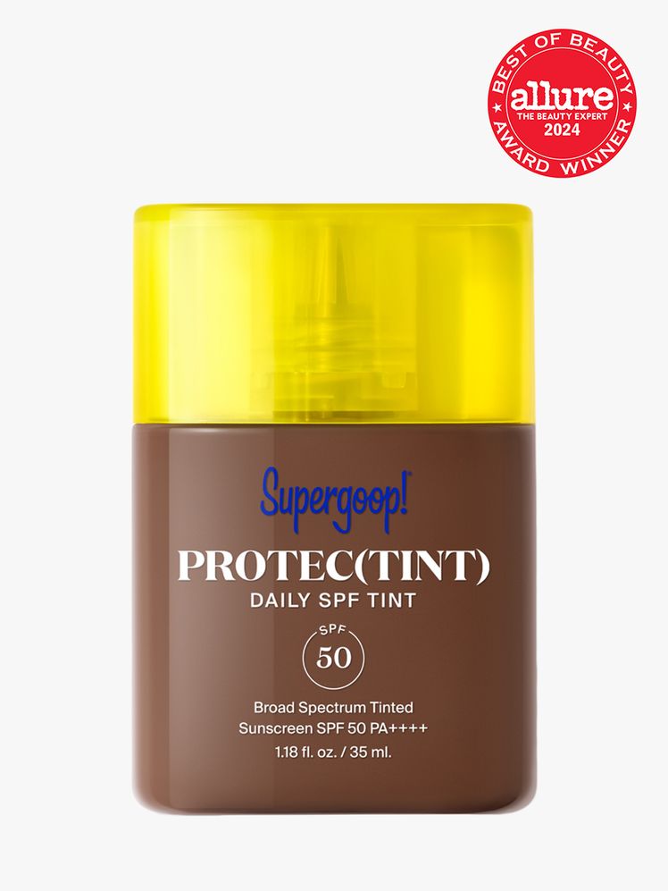 sunscreen in branded clear bottle with yellow cap on light gray background with red and white 2024 allure best of beauty...