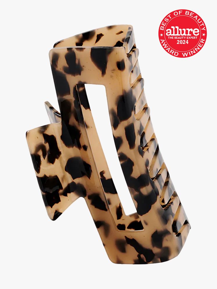 hair clip in brown and black color way on light gray background with red and white 2024 allure best of beauty seal