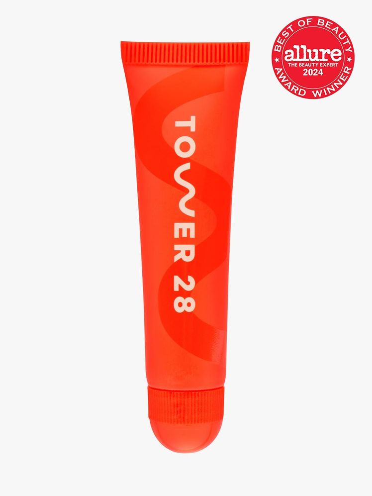 lip product in branded orange tube with cap on light gray background with red and white 2024 allure best of beauty seal