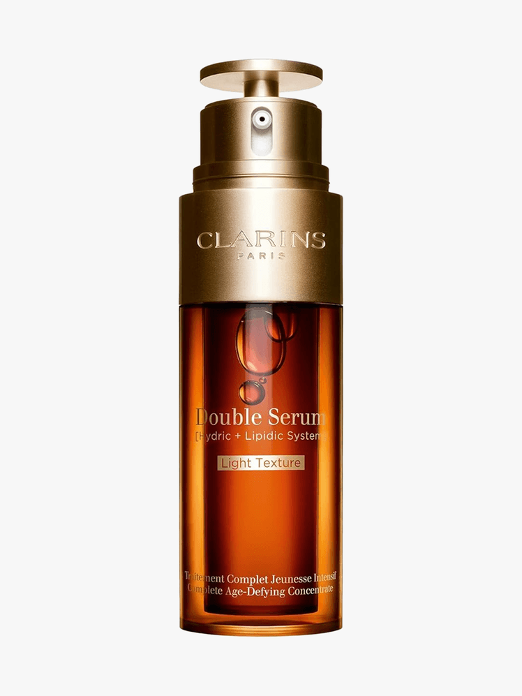 Clarins Double Serum Light branded component in amber with gold components on a light gray background