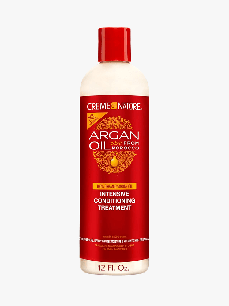 Creme of Nature argan oil intensive conditioning treatment in red packaging on a grey background
