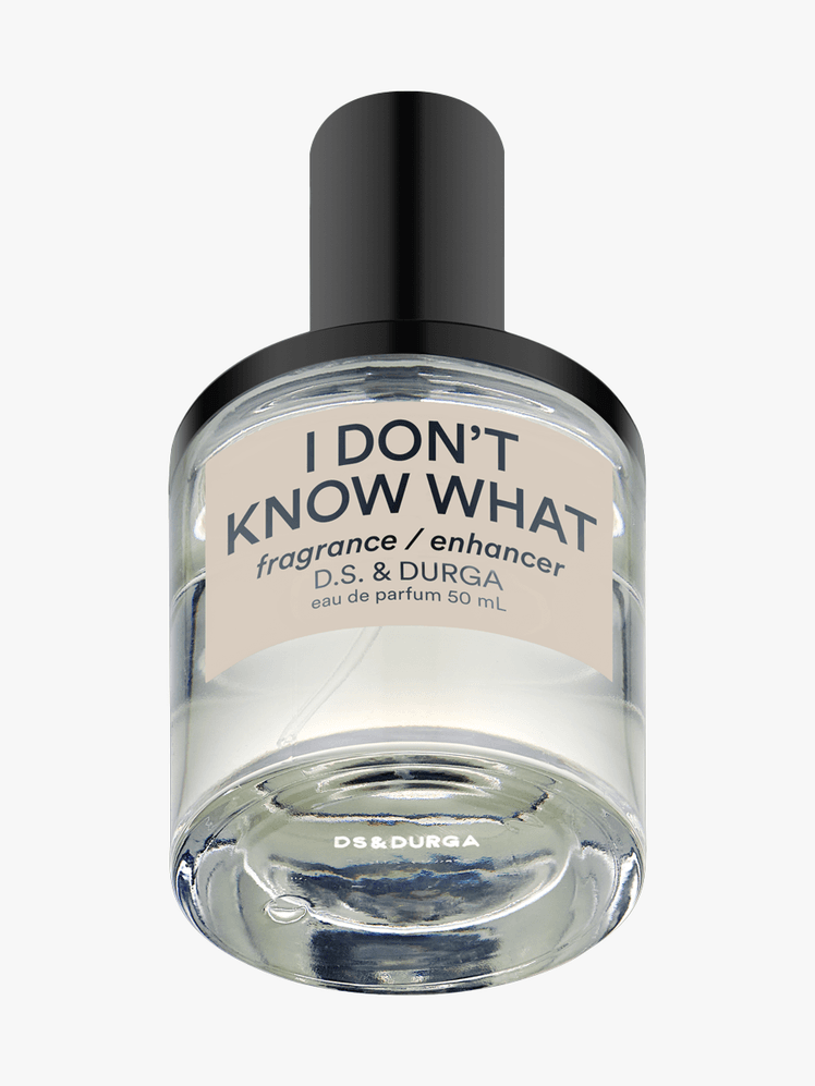 D.S. and Durga I Don't Know What Perfume in clear branded bottle component with black cap on a a light gray background