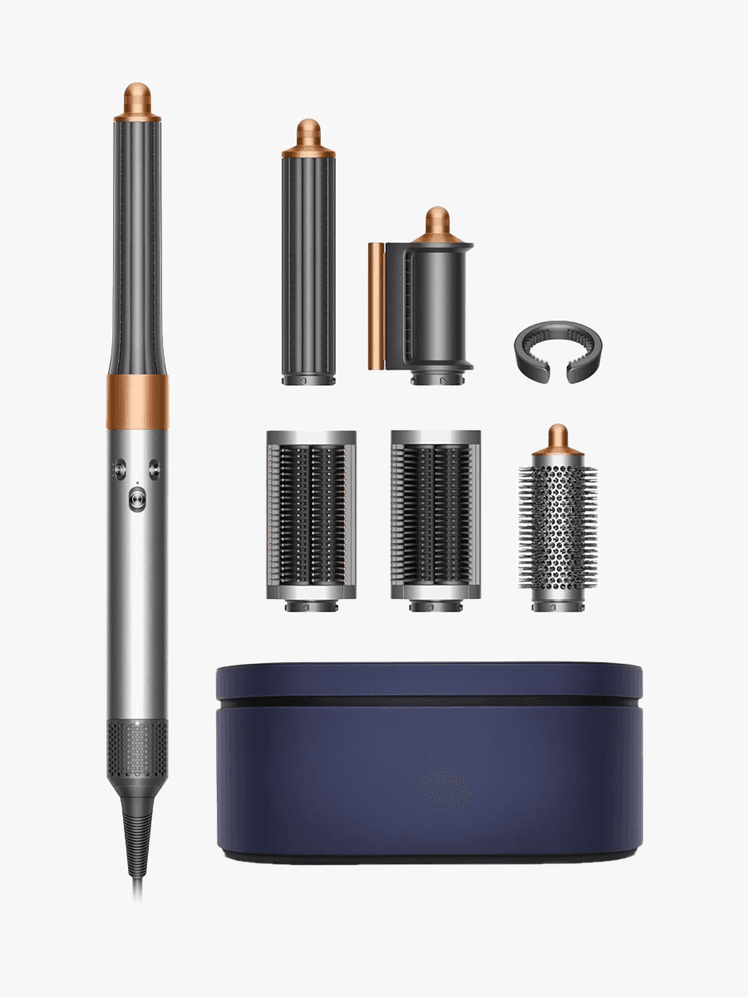 Dyson Airwrap branded components on a light gray background