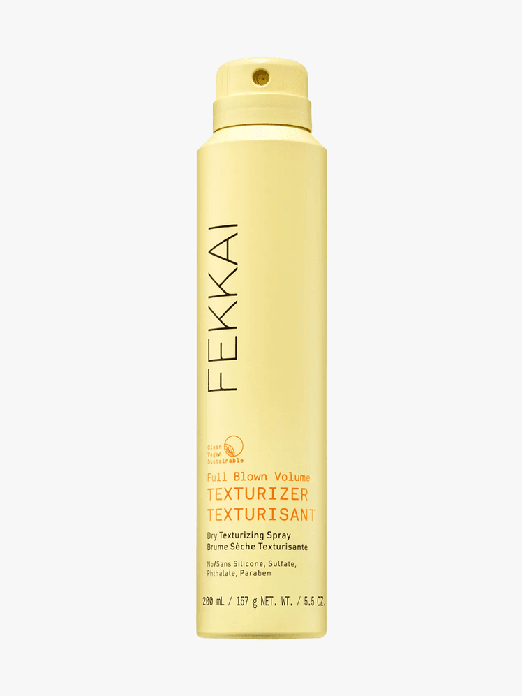 Fekkai Full Blown Volume Dry Texturizing Spray in yellow branded component on a light gray background
