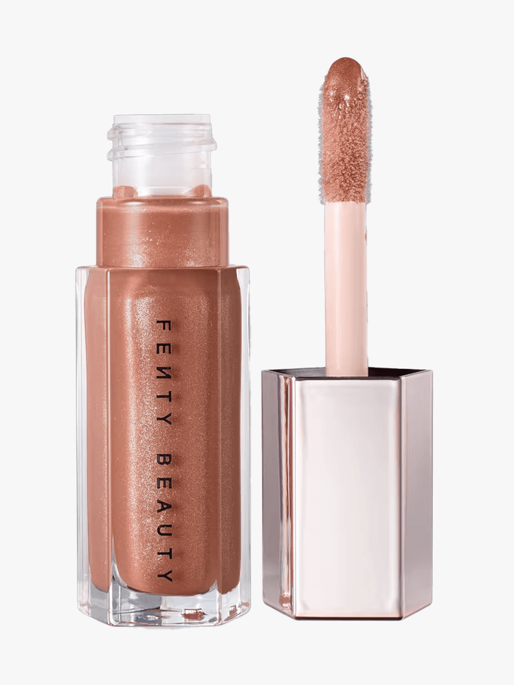 Fenty Beauty Gloss Bomb Universal Lip Luminizer in branded twist up component on a light gray background
