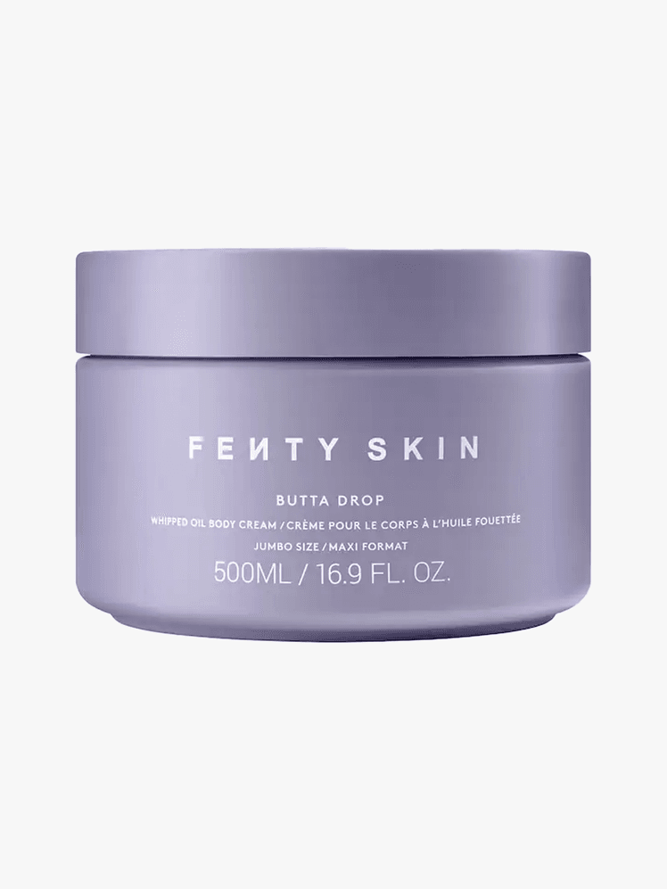 Fenty Skin Butta Drop Whipped Lotion in purple branded tub component with white accents on a light gray background