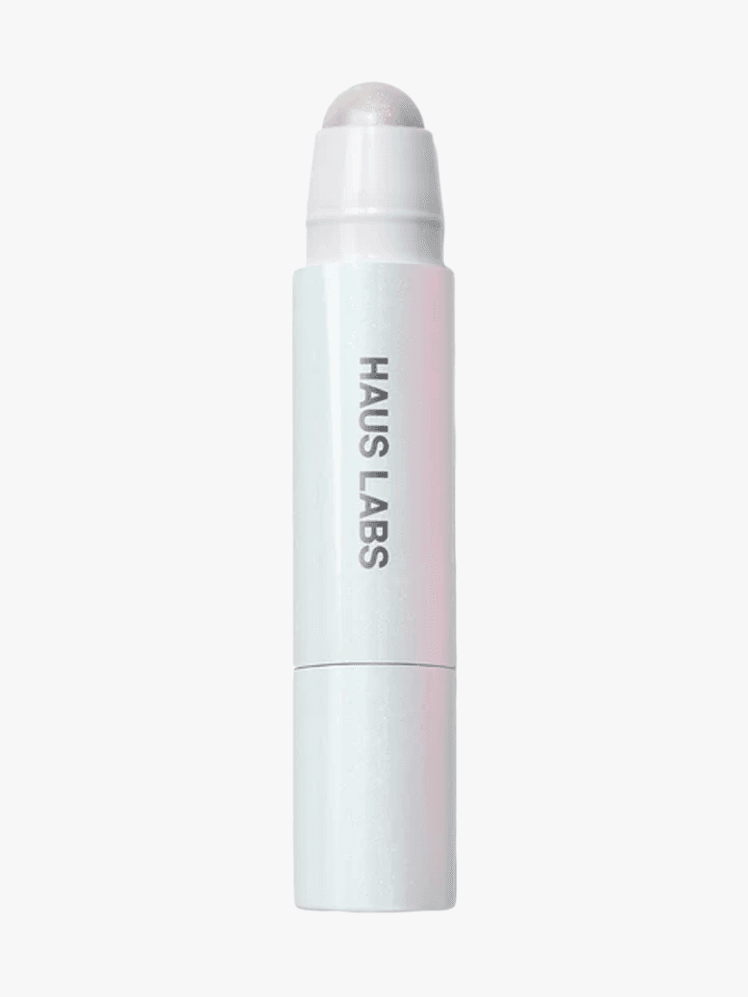 Haus Labs BioRadiant Glassy Balm Highlighter Stick in branded component on a light gray background