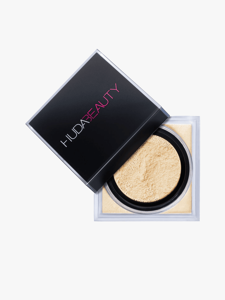 Huda Beauty Easy Bake Loose Baking  Setting Powder in cap branded component on a light gray background
