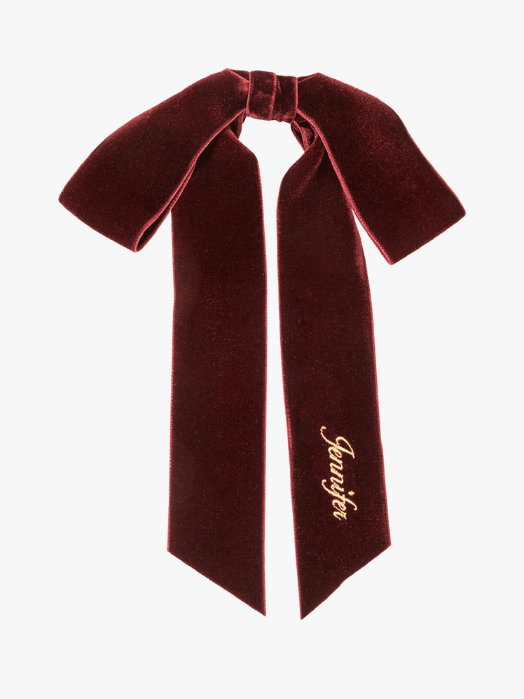 Jennifer Behr Monogram Adley Velvet Bow Barret in Pinot on a light gray background