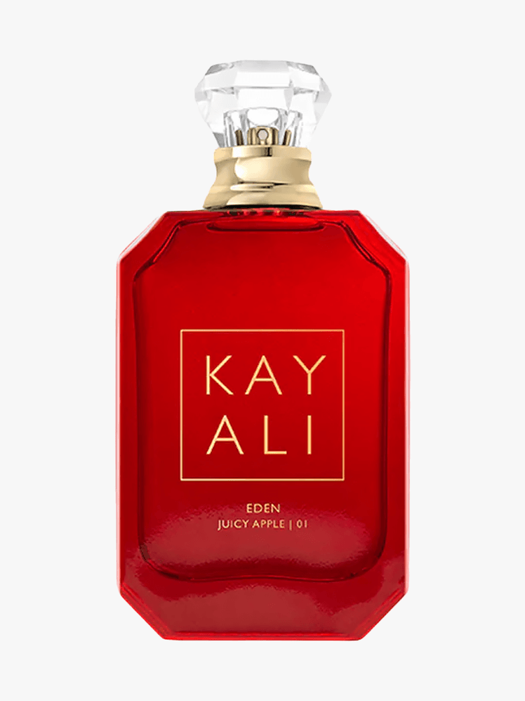 Kayali EDEN JUICY APPLE 01 Eau De Parfum in branded red bottle component with gold accents on a light gray background