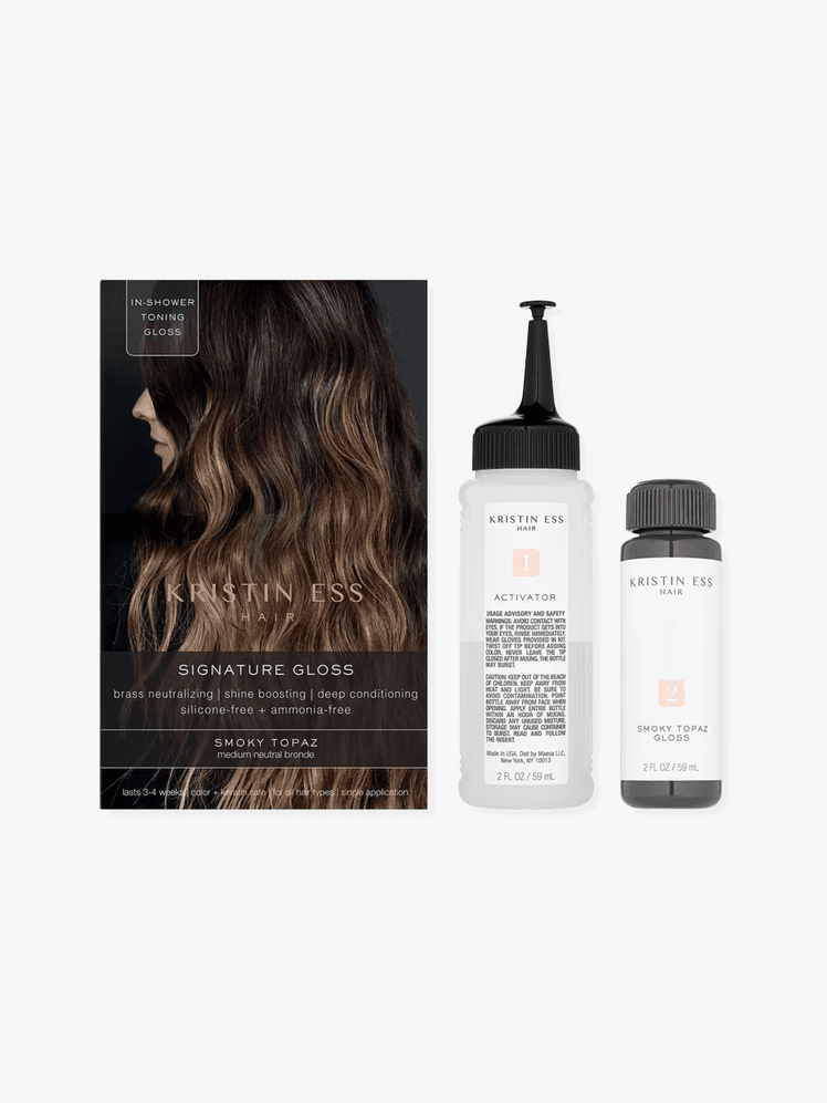 kristin ess signature hair gloss kit featuring box and bottle and applicator on a grey background