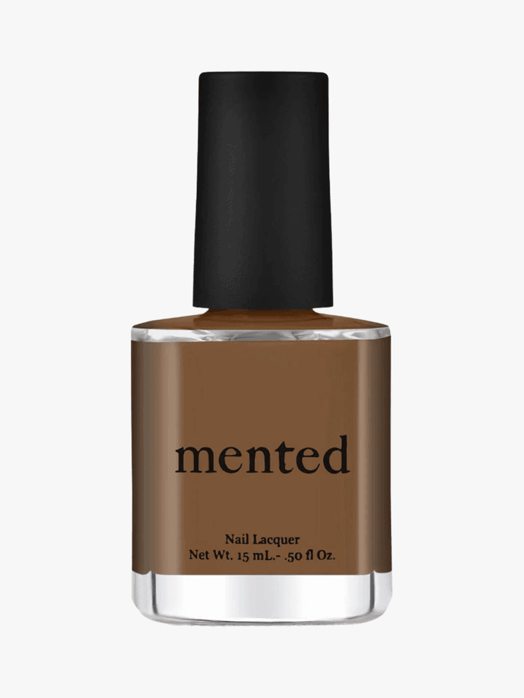 Mented cosmetics brown nail polish in a clear bottle with a black cap and black lettering on a grey background