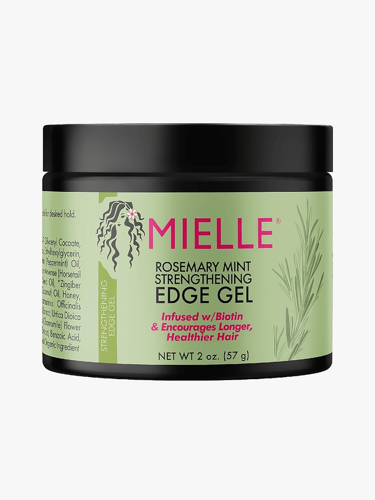 Mielle Organics Edge Control in black branded tub component with green accents on a light gray background