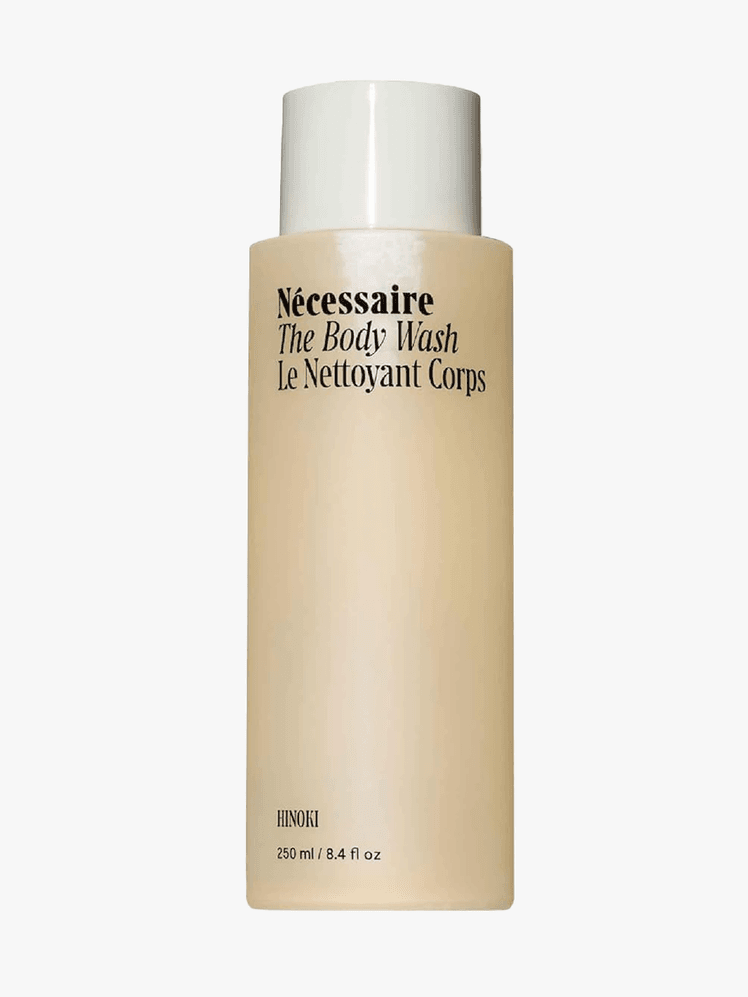 Necessaire Honki Body Wash branded bottle component in beige with black accents on a light gray background