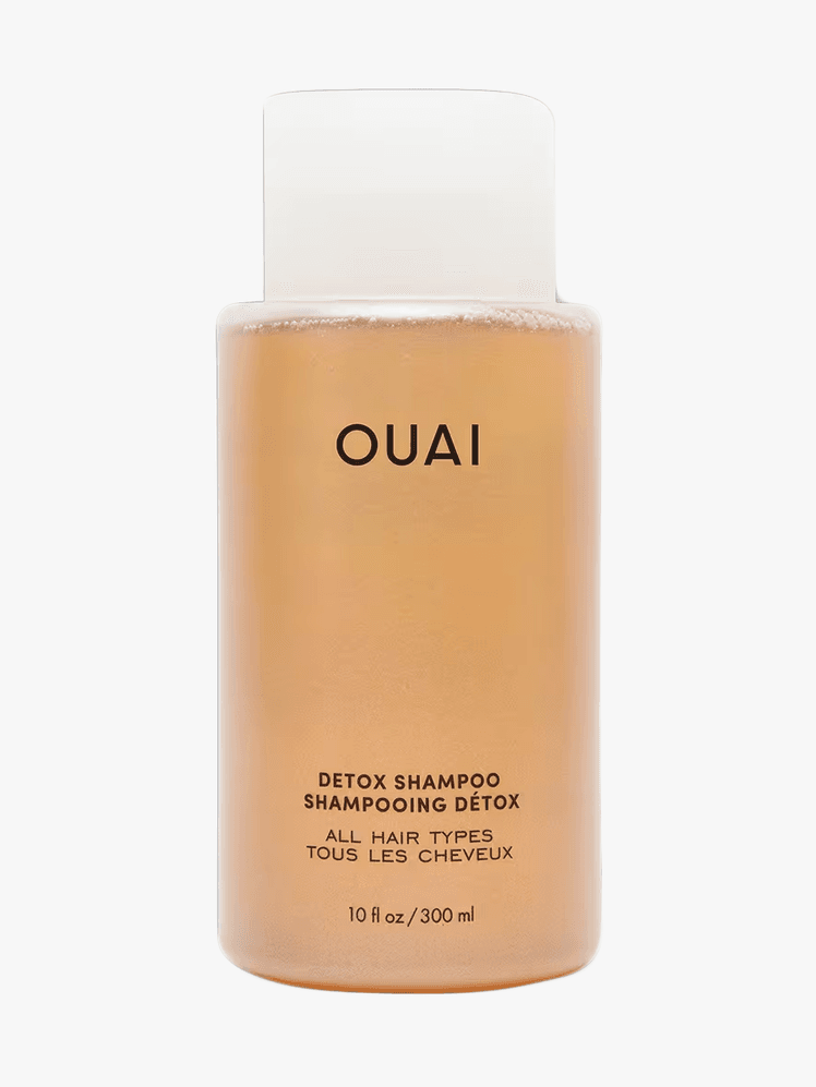Ouai Detox Shampoo in clear bottle component with black accents on a light gray background