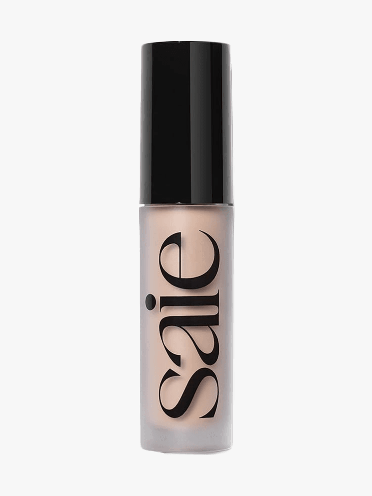 Saie Slip Tint Radiant AllOver Concealer in branded component on a light gray background